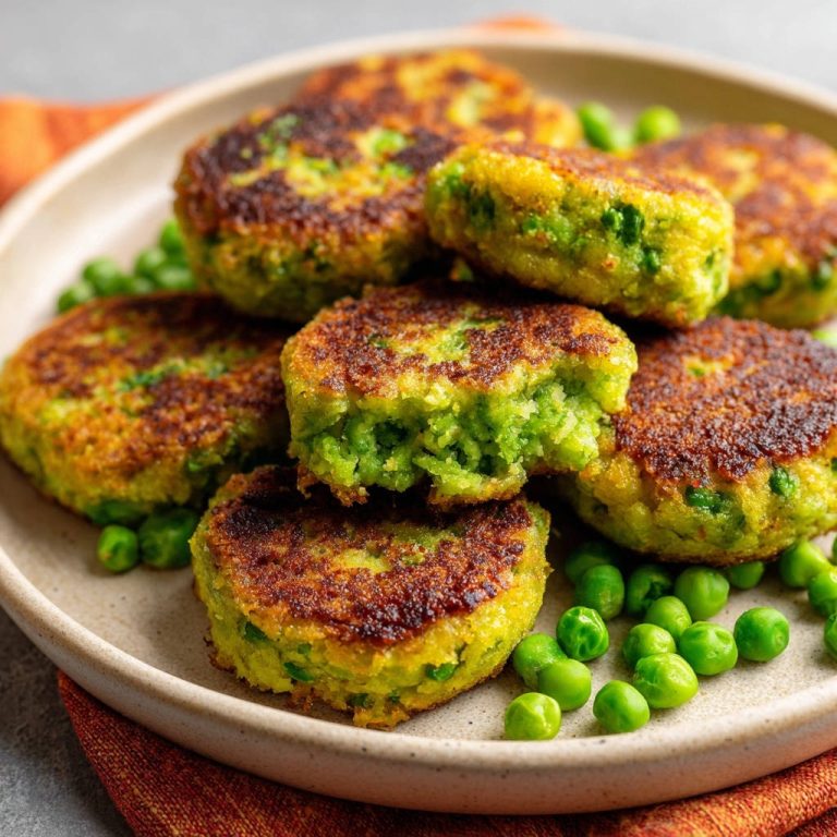 Pea & Rice Patties shown in a close-up cross-section revealing their vibrant green interior and golden-brown crust.