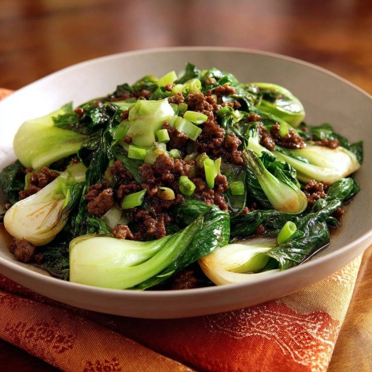 Beef and bok choy stir-fry served in a bowl, showcasing tender greens and savory ground beef.